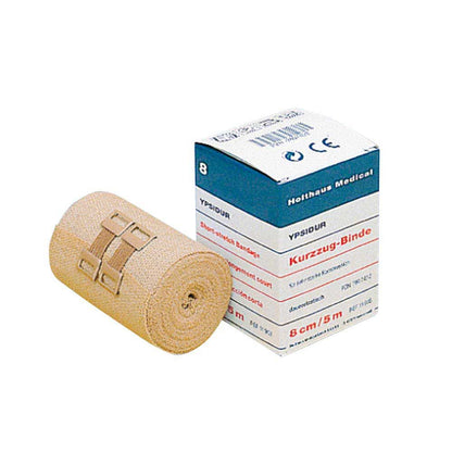 Beige Kurzzugbinde mit Befestigungsklammern, dauerelastisch, als aufgerollte Bandage